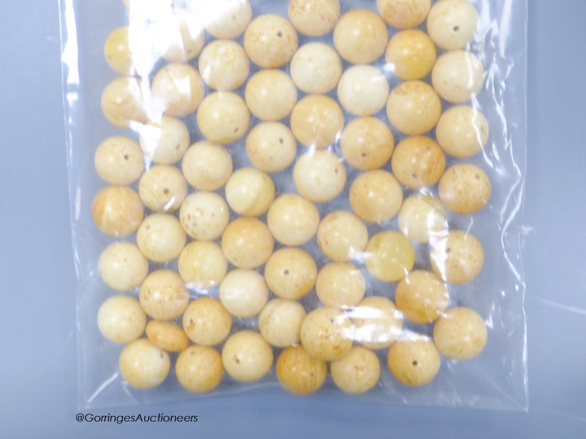 A quantity of loose amber prayer beads, gross weight 30 grams.